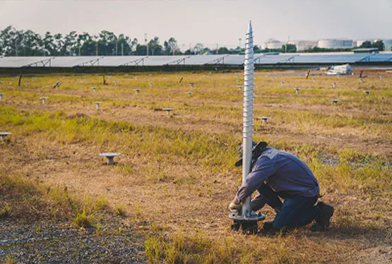 Someone putting up a drilling pole