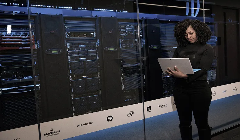 Person working in front of servers
